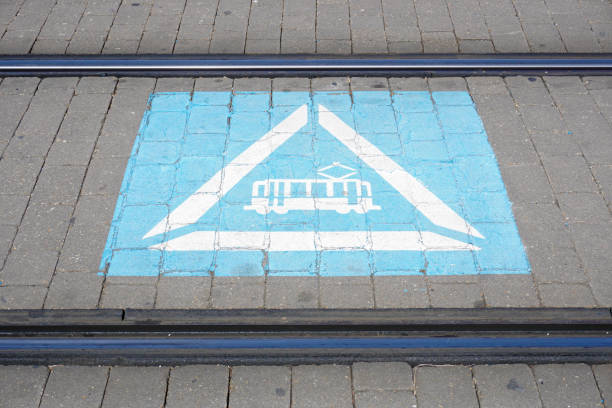 tram signal painted on the road between tram tracks. sustanable and electric transport concept