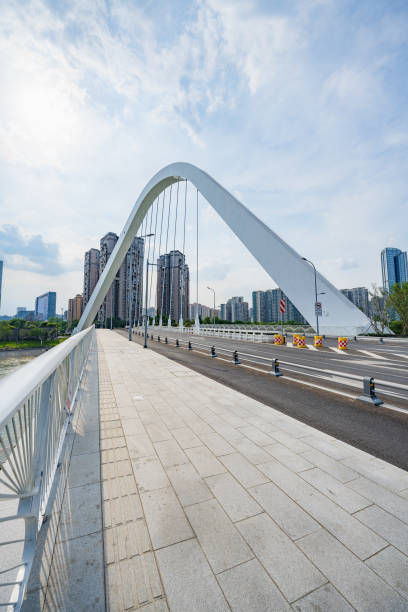 istock Sunny riverside bridge and Financial City 1404938660