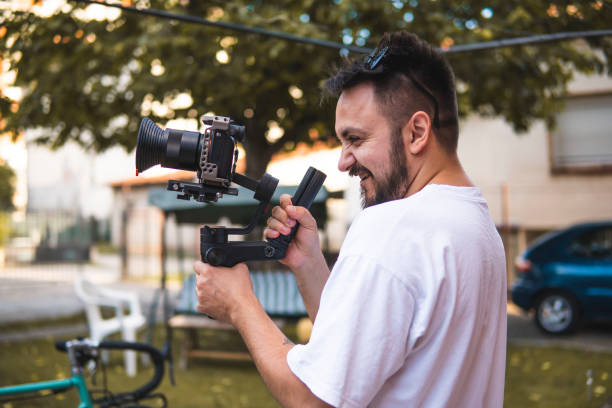 istock Guy holding a camera on a gimbal while taking pictures. 1404942457