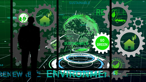Man looking at digital earth with interlocking green energy symbols.