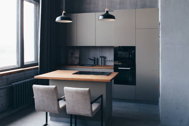 istock Modern kitchen interior design with furniture and table. 1404952232