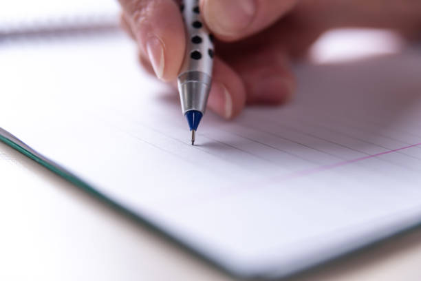istock Close up of pencil writing, copy space, reading, nearsightedness, education concept, selective focus 1404952627