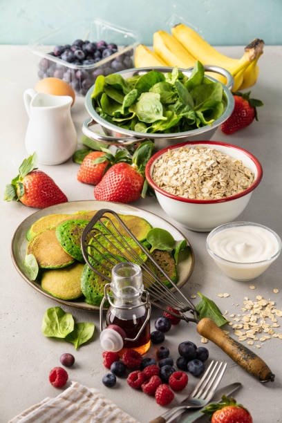istock Spinach pancakes and ingredients, top view 1404957977