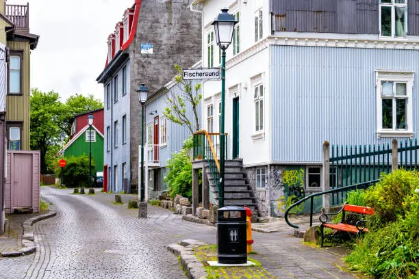 Reykjavik, Iceland Mjostraeti quiet alley street road in downtown center and houses buildings with sign for fischersund