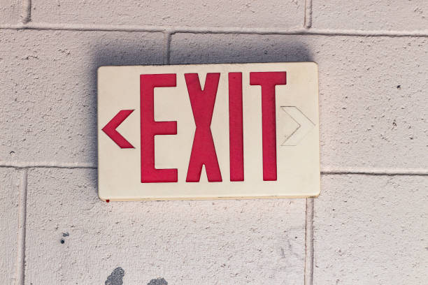 istock exit sign in hallway of office building 1404960646