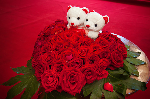 Happy marriage. Bear doll and beautiful wedding bouquet