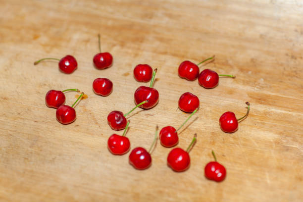 sweet cherries on wooden table