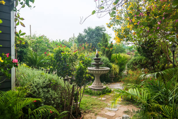 Beautiful colorful flowers and fountain in spring  garden