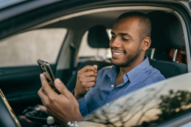 istock Man on video call in parked car 1404972340