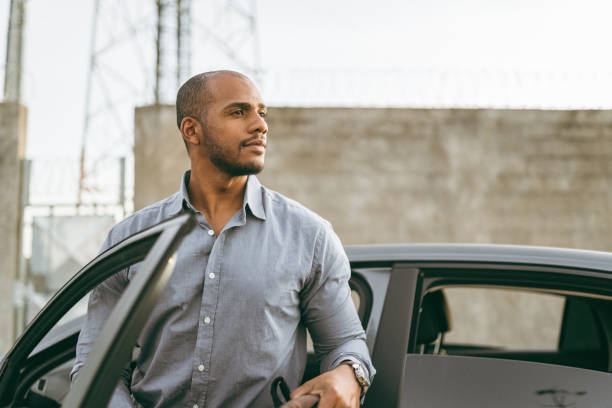 istock Man getting out of car on the way to work 1404972343