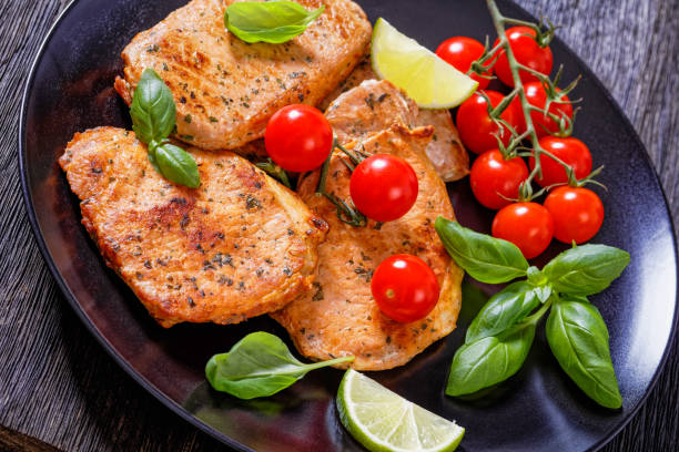 istock tomato basil pesto fried pork cutlets on plate 1404972592