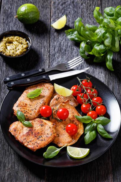 istock tomato basil pesto fried pork cutlets on plate 1404972600