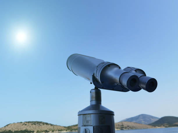 istock binocular isolated on the blue sky watching on the sea 1404974451