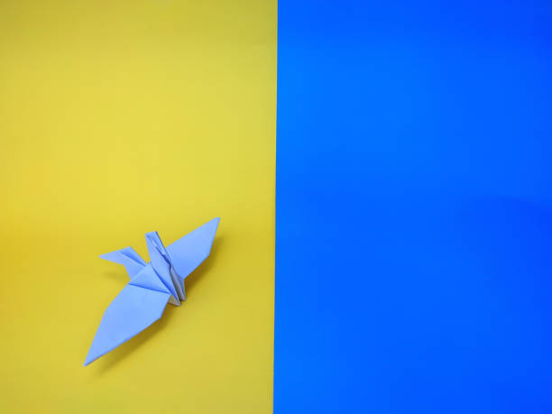 istock Origami crane on the Ukraine flag 1404978361