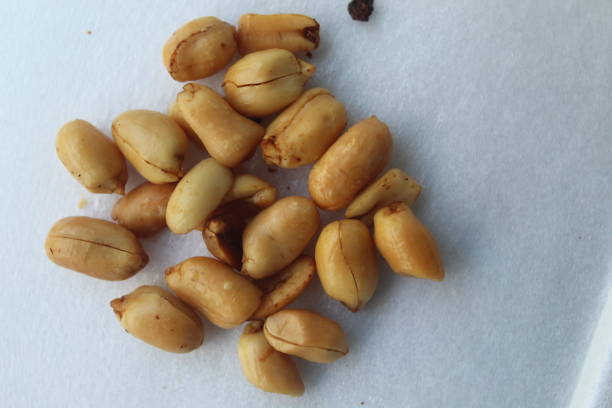 istock some fried peanuts on a white backgroundFried peanuts with onion aroma are usually eaten as a snack 1404978798
