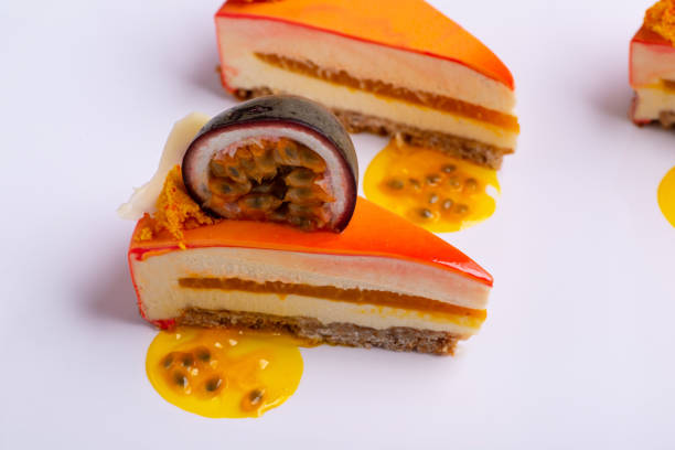 A top view shot of sliced orange cakes on a white surface