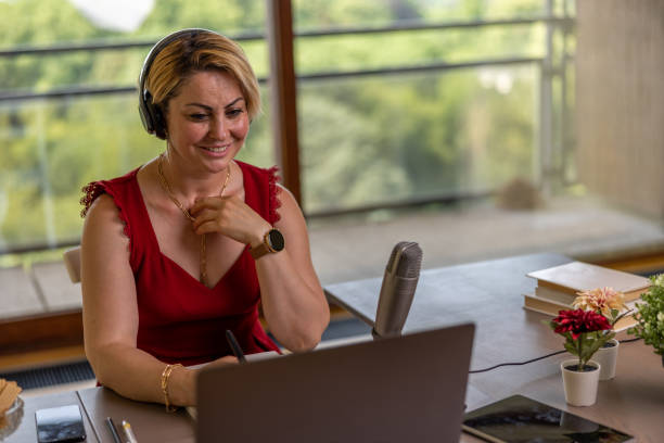 istock Woman using technology at home and in the office 1404982135