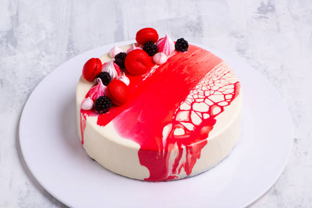 istock Angle shot of a mirror glaze cake decorated with berries. 1404982406