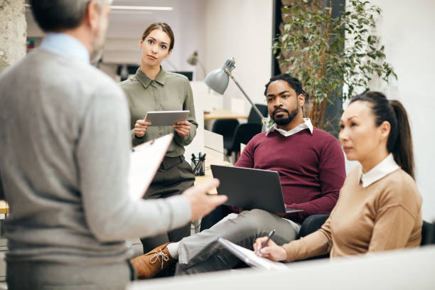 istock Multiracial business team having a meeting while working in the office. 1404987282
