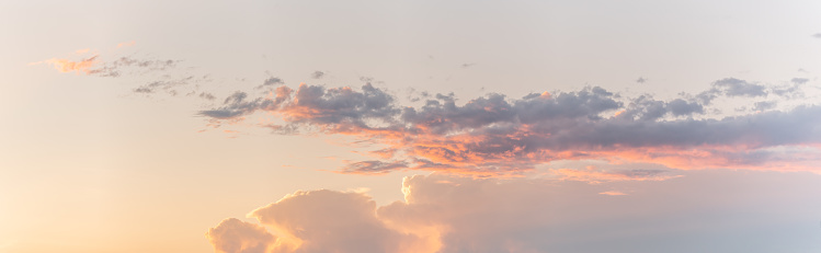 Large pink cloud at sunset in spring. panorama, panoramic, banner. Alsace, France.