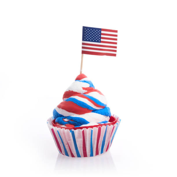 American independence day, celebration and holidays concept - cupcake in disposable tableware and stars.