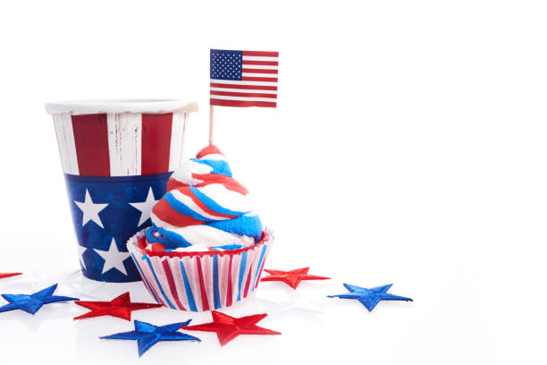 istock American independence day, celebration and holidays concept - cupcake in disposable tableware and stars. 1404990795