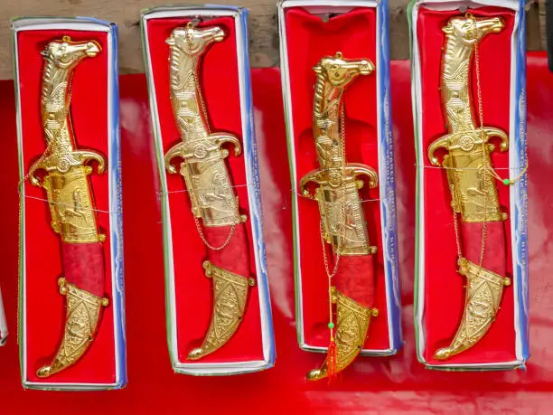 Photo of Display of dagger weapon in shop, ready to be sell in market.
