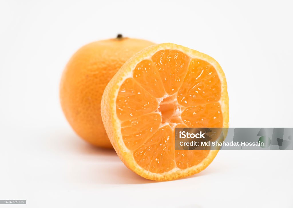 whole and slice Tangerine or kamala over on white background Bangladesh Stock Photo