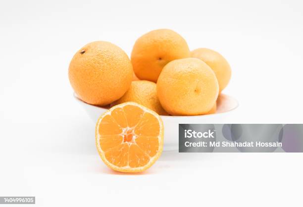 Whole And Slice Tangerine Or Kamala Isolated On White Background Stock Photo - Download Image Now