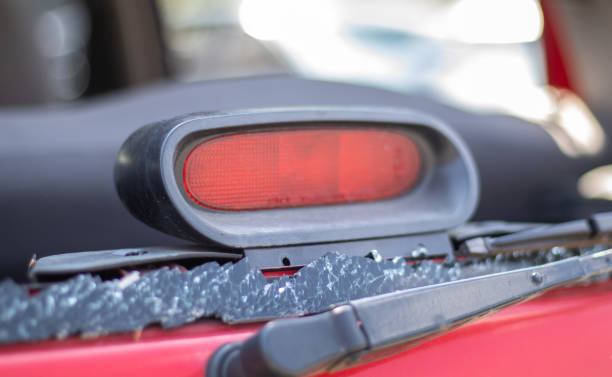 istock A car after an accident with a broken rear window. Broken window in a vehicle with a rear brake light. Interior wreckage, detailed close-up view of a damaged modern car. 1404997098