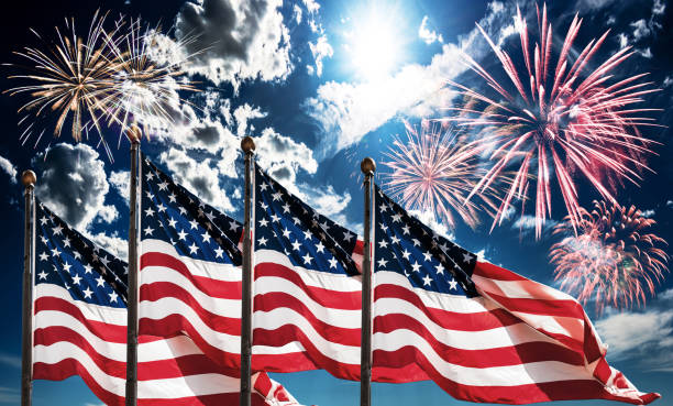 fourth of july celebration with fireworks and flags stock photo