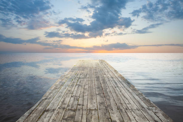 istock Lake at Sunset. Wooden jetty and sky clouds 1404999834