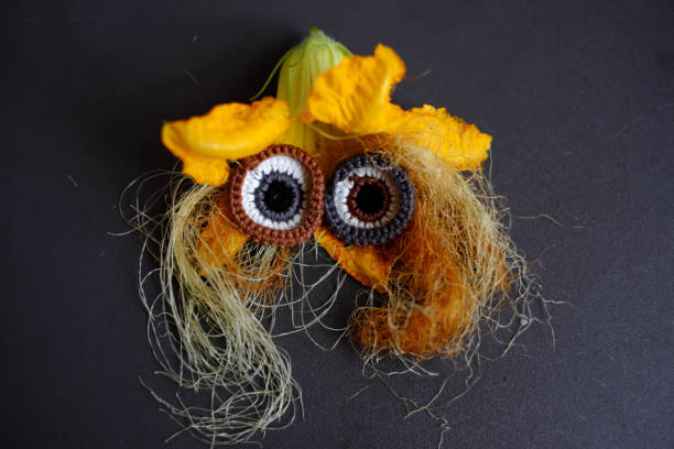 istock Funny face set up from food, small corn, pumpkin flower, corn silk 1405001524