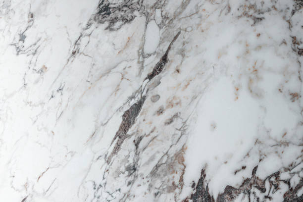 istock White marble stone texture top view. abstract pattern with grey and brown streaks for background or design art 1405001609