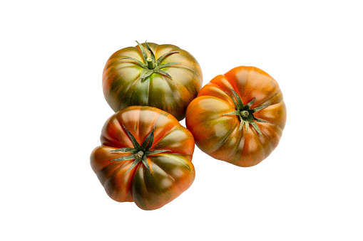 Heirloom tomato isolated on white background. Tomato clipping path.