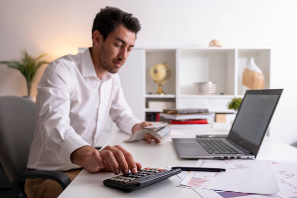 istock businessman calculating bills in economic crisis 1405004473