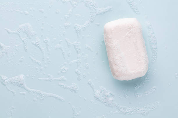 istock Soap bar and foam on white background, top view. Mockup for design 1405007965
