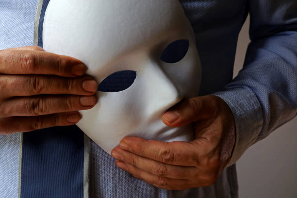 istock person in jeans with white theatrical mask 1405010680