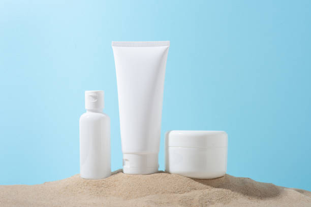istock cream set, moisturizer on sand on blue background 1405011188
