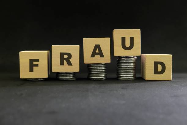 Investment scam, fraud and Ponzi scheme concept. Stack of coins on wooden blocks with word ponzi in dark black background. Investment scam, fraud and Ponzi scheme concept. Stack of coins on wooden blocks with word ponzi in dark black background. block cube pyramid built structure stock pictures, royalty-free photos & images