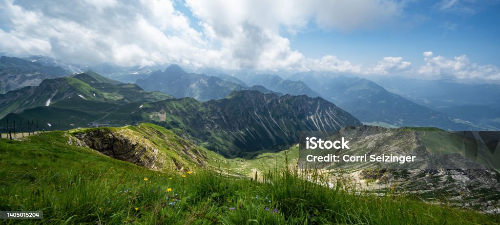 Panoramic view of Kanzelwand / Fellhorn in the Kleinwalsertal in Austria, with a view of mountain lake and mountains with lush green meadow and blue sky - Mountains Landscape Background Banner Panorama Panoramic view of Kanzelwand / Fellhorn in the Kleinwalsertal in Austria, with views of mountain lake and mountains with lush green meadow and blue sky - mountains landscape background banner panorama Austria Stock Photo