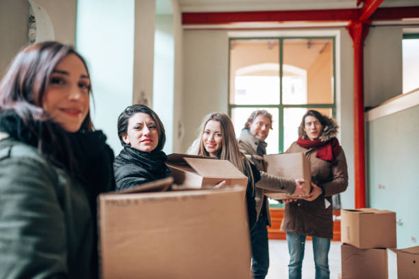 istock people helping each others during the relocation 1405016173