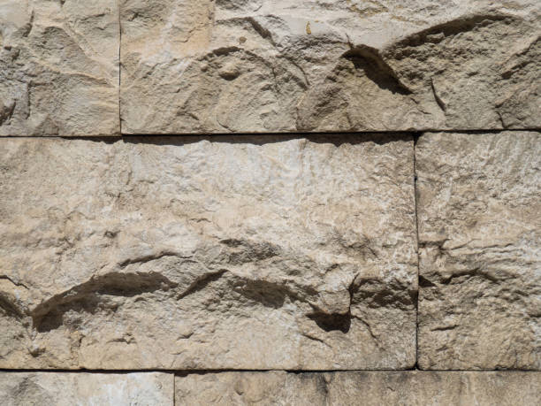 istock Uneven, bulky tiles. Stone background. Masonry. 1405016389