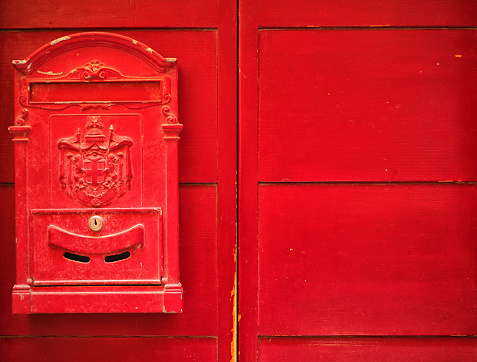 old red door with mailbox