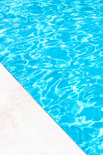 yellow life preserver floating in swimming pool, summer background