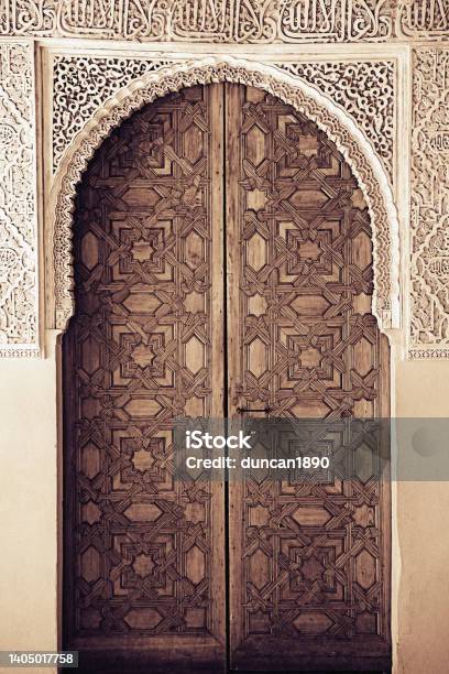 Traditional Moorish Architecture Ornate Wooden Door Toned Black And White Stock Photo - Download Image Now