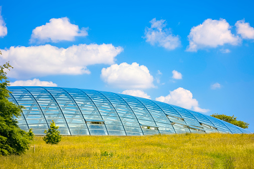 Paris, France - August 26 2023: Modern Greenhouse at the Jardin des Serres d'Auteuil in summer. This botanical gaden is a public park located in Paris, France