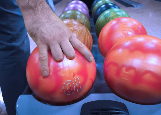 istock the man's fingers are inserted into a bowling ball 1405019074