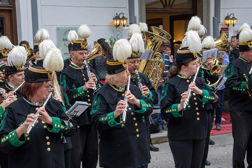 Teenage boy playing saxophone in high-school band