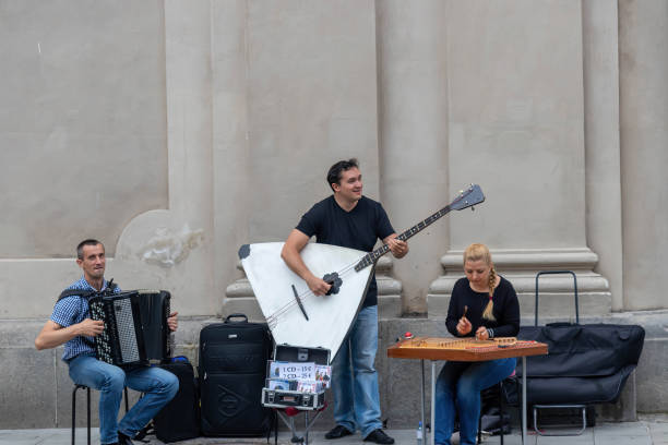 Munich, Germany - June 30, 2016: A trio of street musicians at Viktualienmarkt.